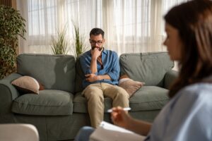 Man talking to his therapist about when to seek inpatient mental health treatment.